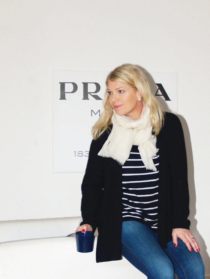 Prada Marfa wall art, striped knit and J Brand jeans on blogger Annika Soulcityguide