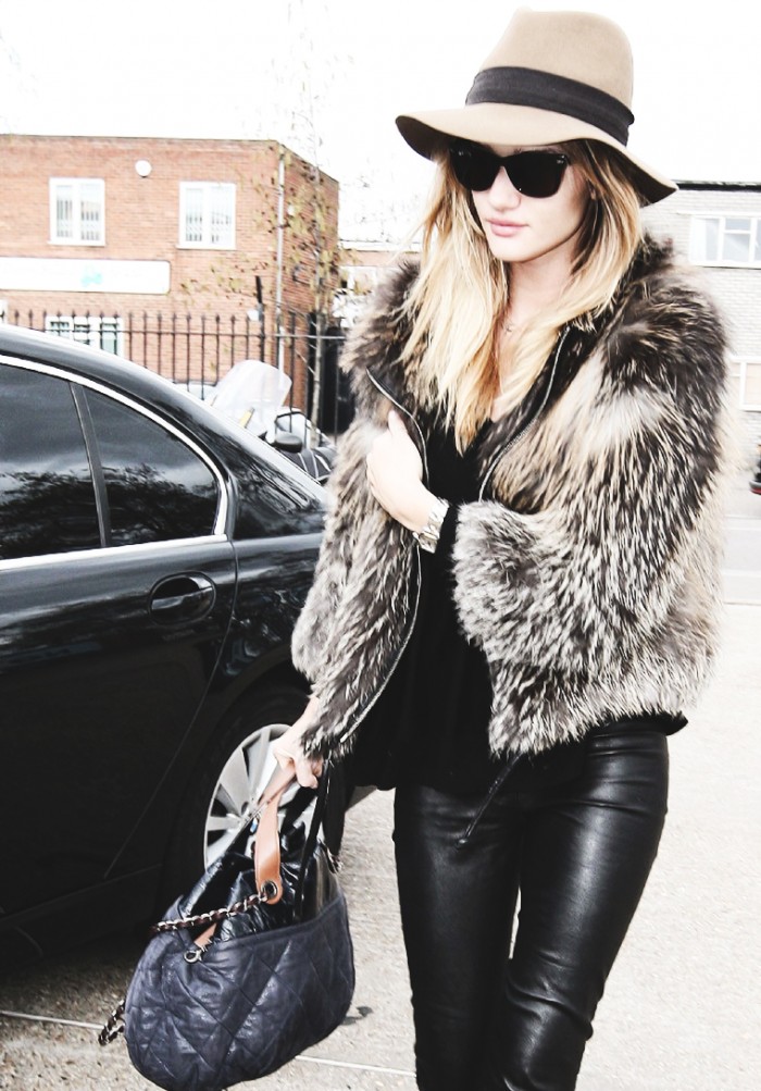 Rosie Huntington-Whiteley in a fur jacket, leather pants and a hat