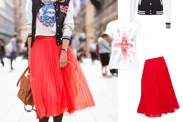 Streetstyle photo of girl in red midi skirt with varsity bomber jacket and printed t-shirt