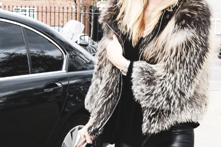Rosie Huntington-Whiteley in a fur jacket, leather pants and a hat