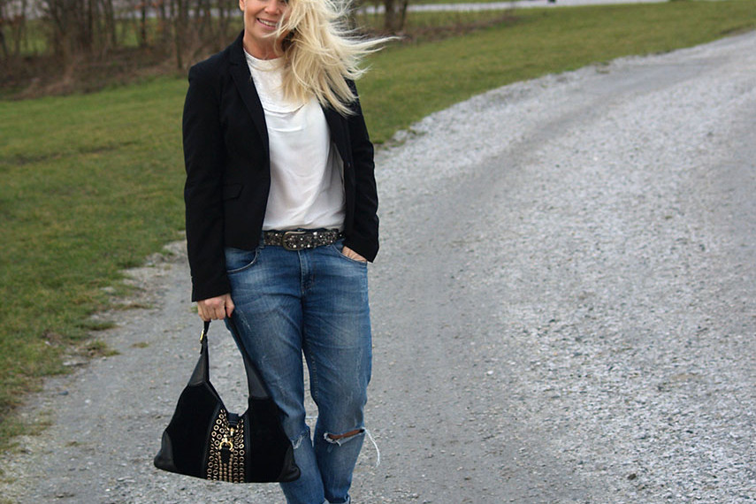 Embroidered white blouse with a black blazer and boyfriend jeans
