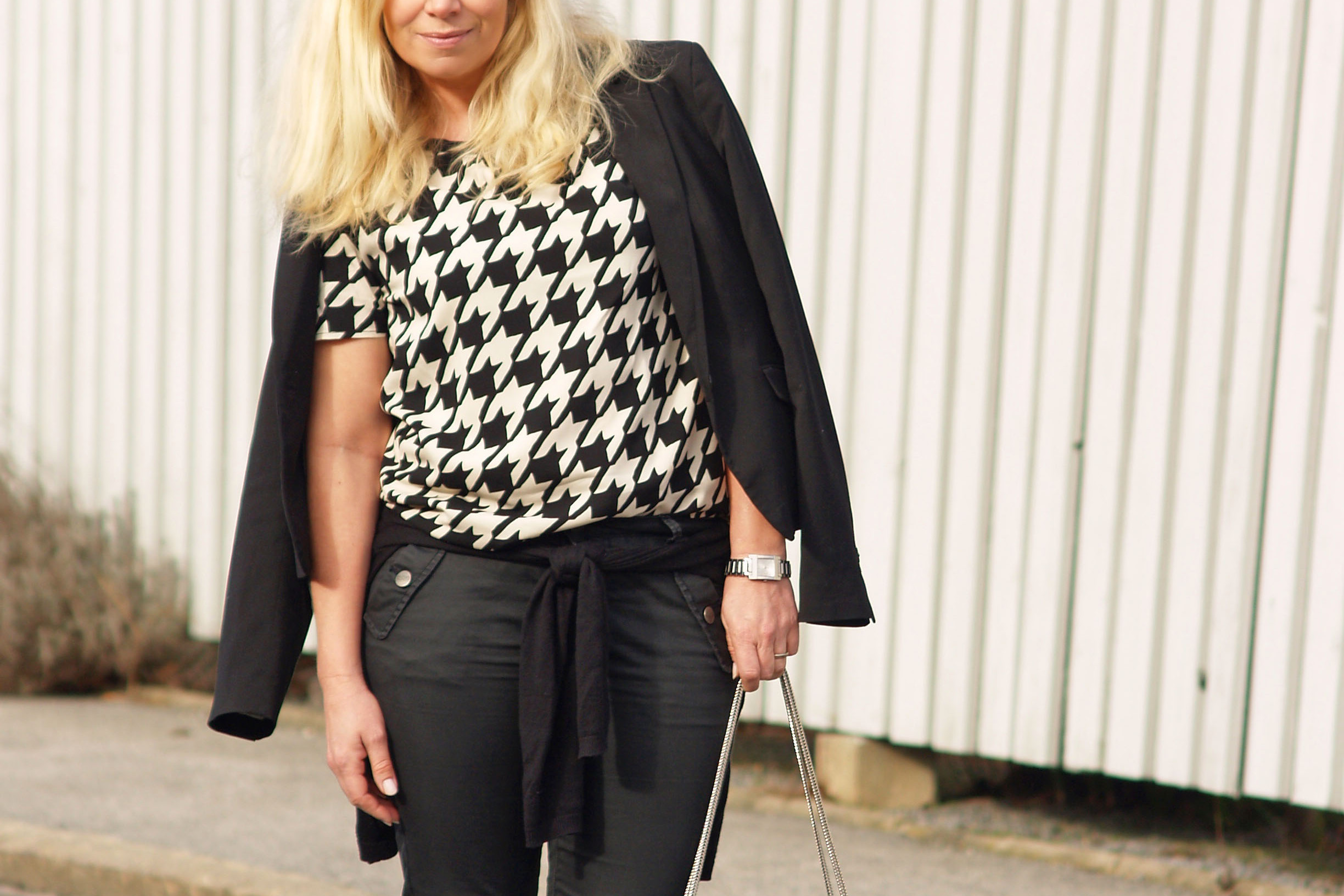Black and beige blouse from Six Ames and a Betty bag from Saint Laurent